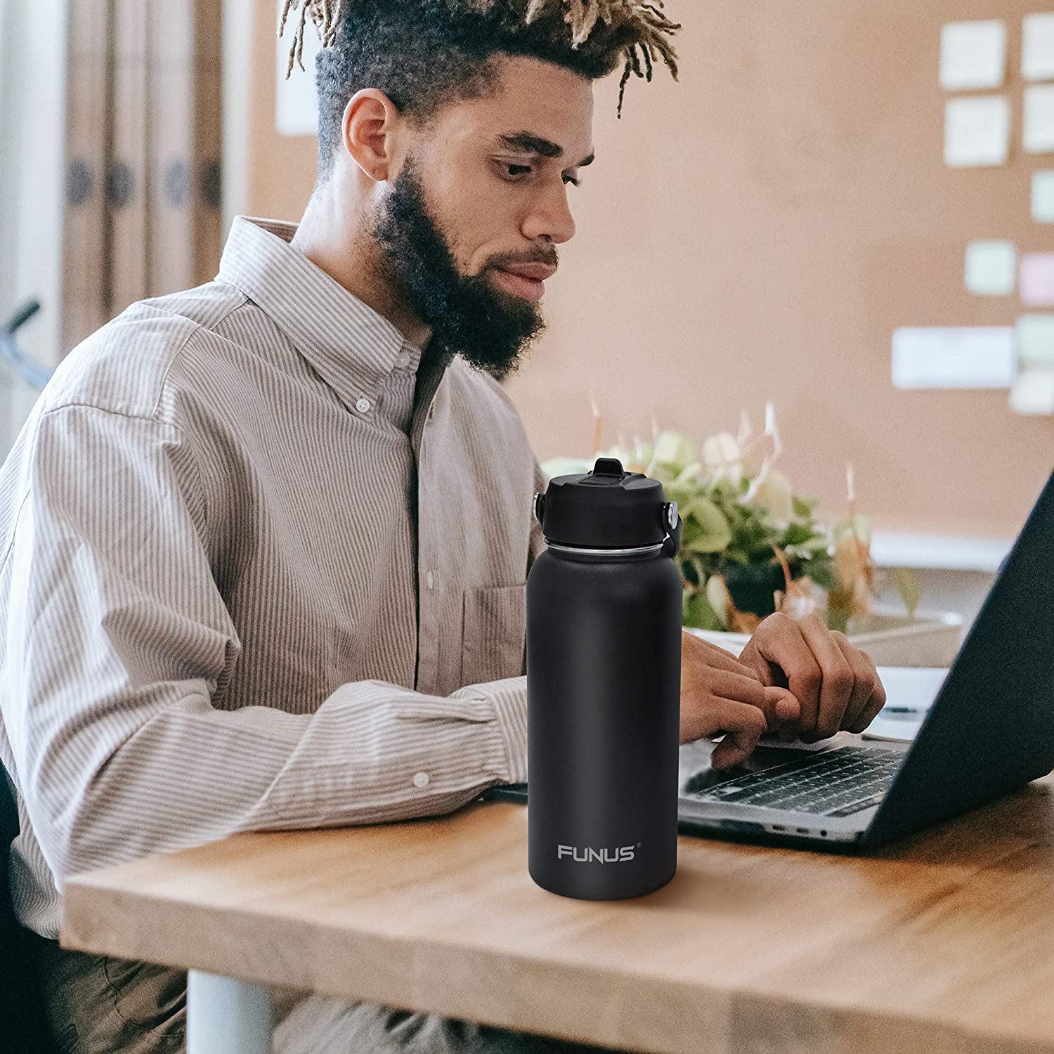 Free Photo  Man drinking from thermos